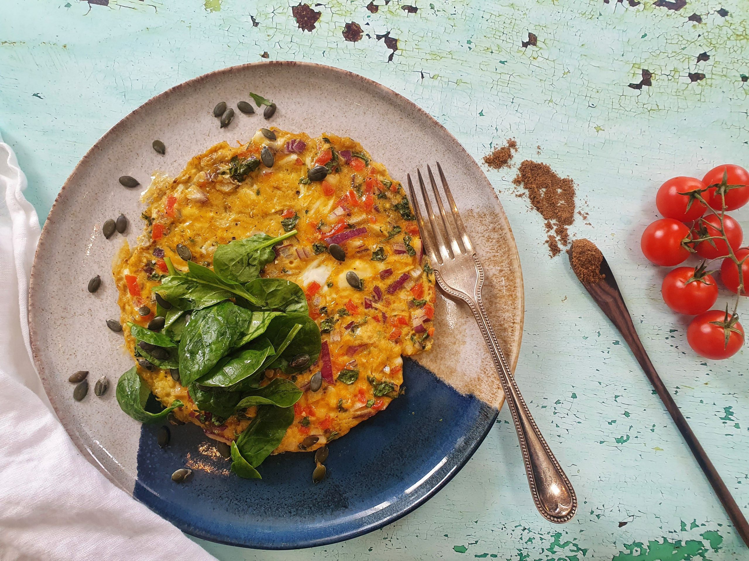 Spiced masala omelette with red onion, cherry tomatoes & coriander