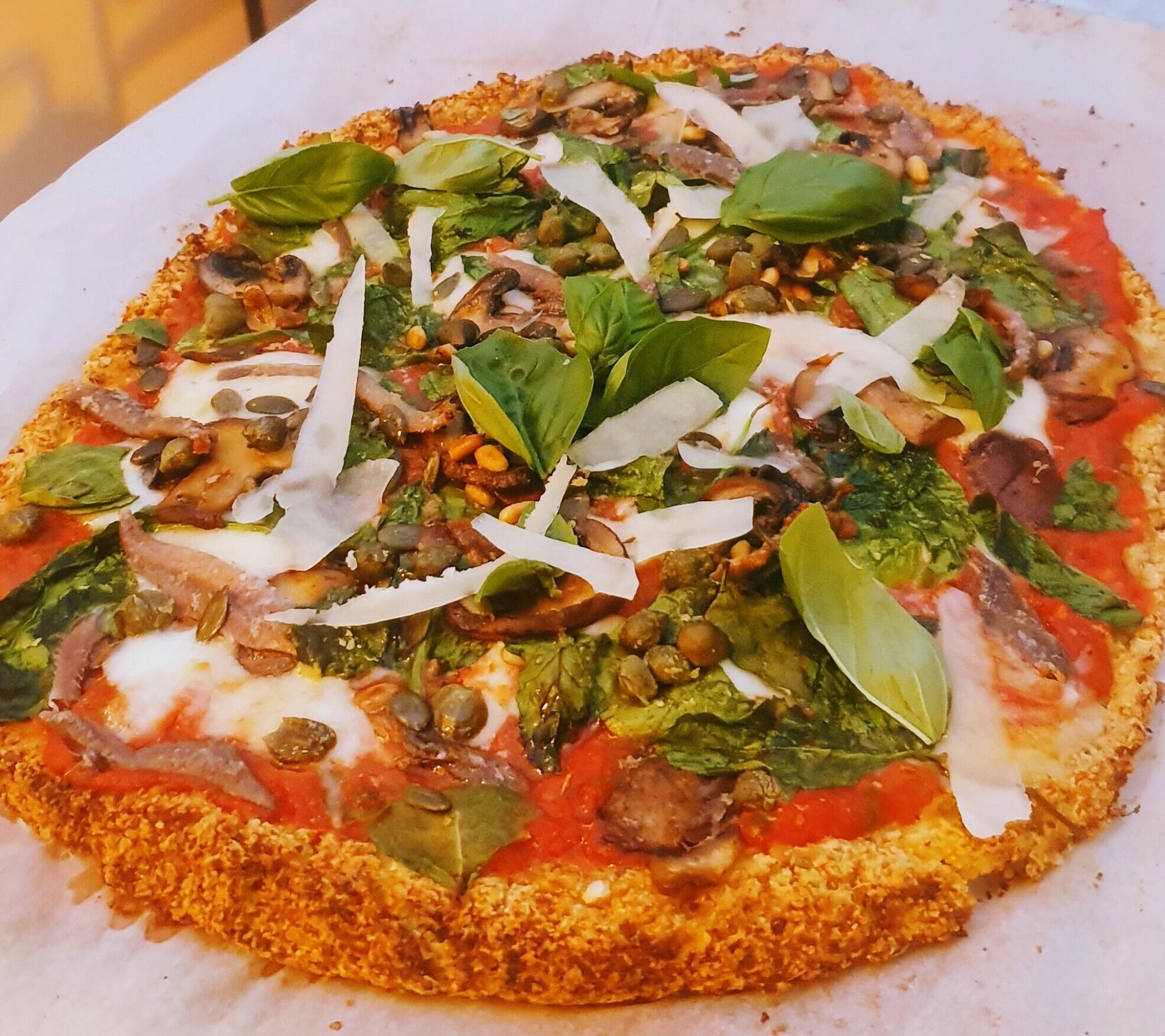 Cauliflower & almond pizza with all your favourite toppings