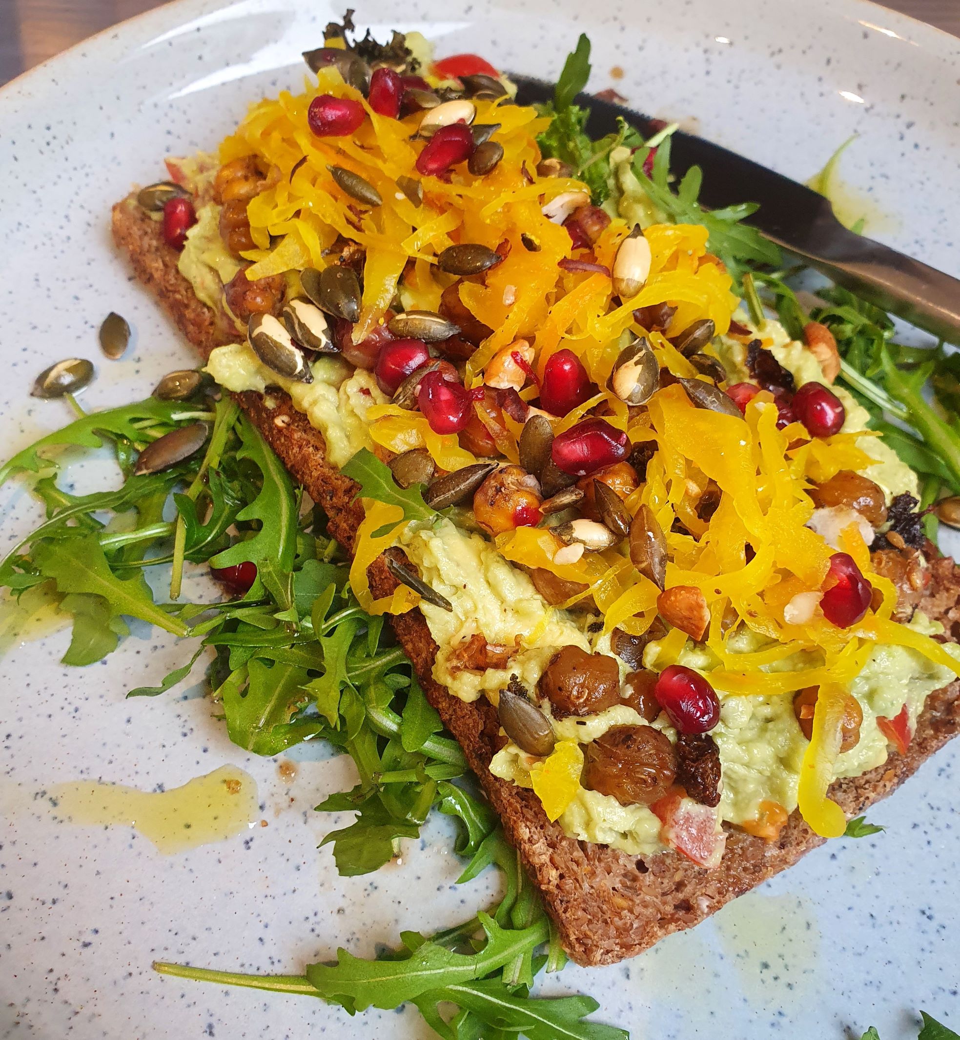 Smashed Avocado & Roasted Chickpeas On Rye with Turmeric Sauerkraut